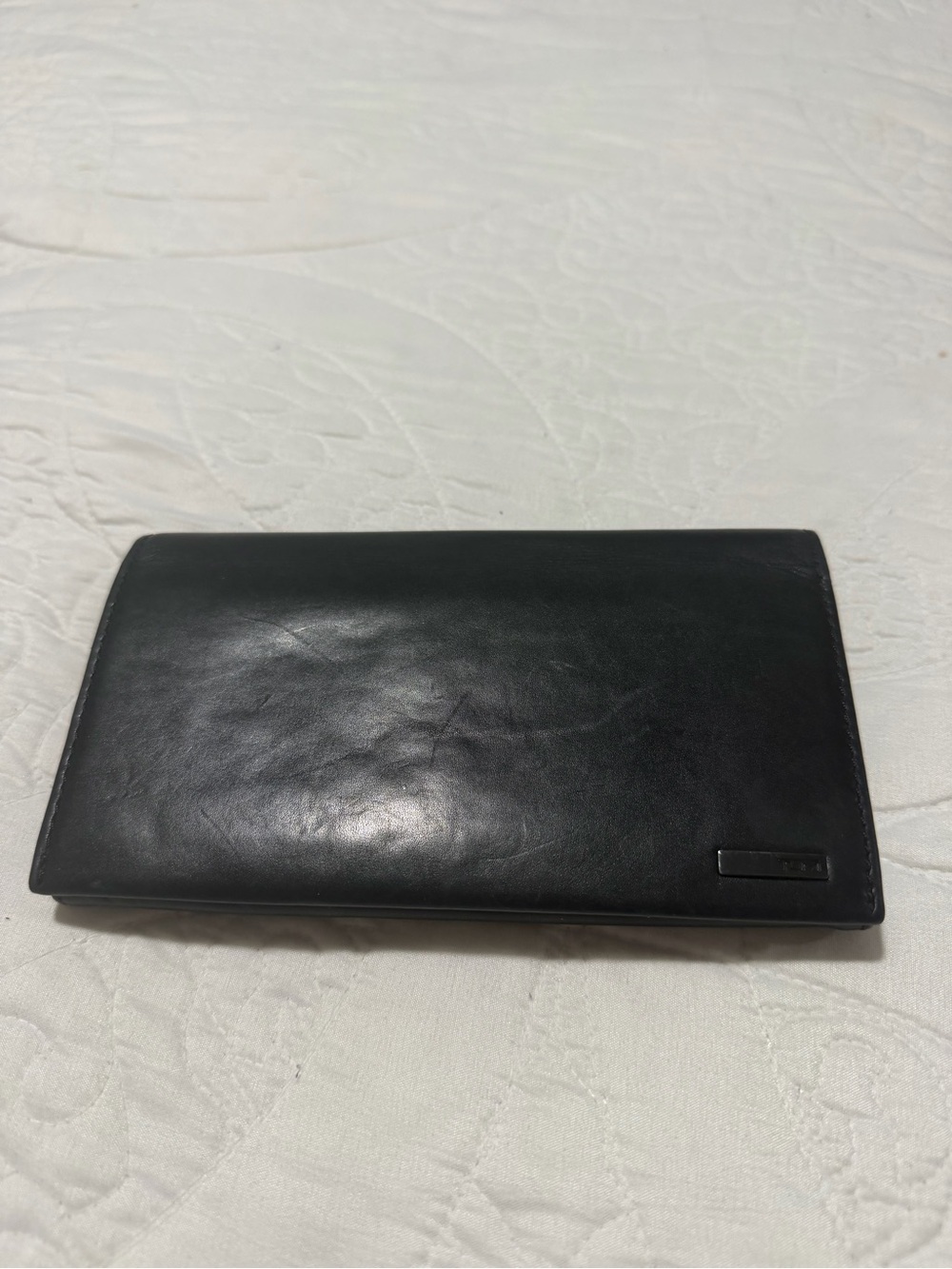 Tumi Black Leather Bi-Fold Wallet with Metal Logo